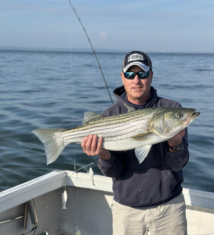 Hooked a big striped bass using a variety of techniques on this perfect fishing day!