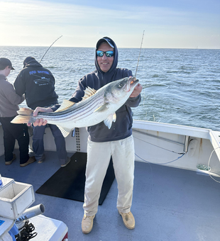 Landed a big striped bass while deep sea fishing in Neptune City, NJ!