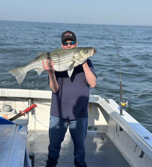 Hooked a massive striped bass while exploring the best fishing spots in Neptune City!