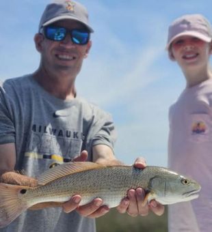 Smiling redfish success on St. George Island trip
