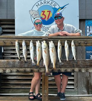 Couple Redfish fishing in Corpus Christi, TX.