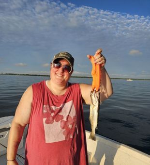 Proud Speckled Trout catch on calm Gulf waters