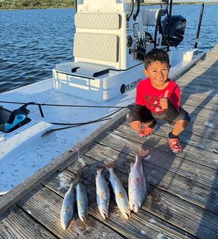 Smiles, fishing rods, and family fun—Port Isabel is the perfect place to enjoy a day on the water together!