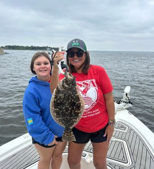 Smiles on their Flounder Catch - Oak Island, NC.