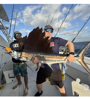 Reeling in a big one out here on the open sea.