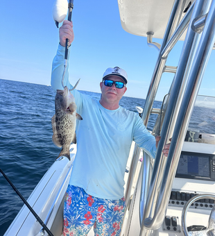 Reeling in a Gag Grouper on a perfect day in Panama City Beach!