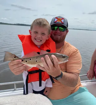Displaying prized Gag Grouper catches