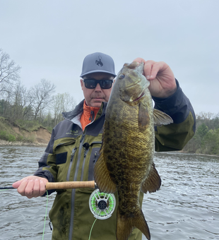 Nice smallmouth bass on the fly today! Great fishing conditions despite the cloudy skies.