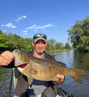 Huge 26-inch Smallmouth Bass caught fly fishing in Stanwood!