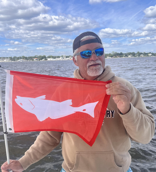 Light tackle adventure in Oriental waters - partly cloudy skies made for exciting fishing conditions!