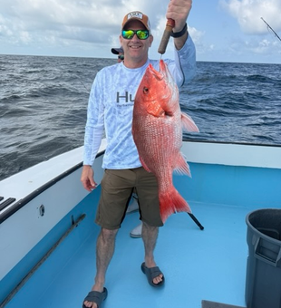 Hooked a big red snapper while enjoying the partly cloudy weather!