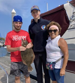 Solid flounder catch on a family fishing trip