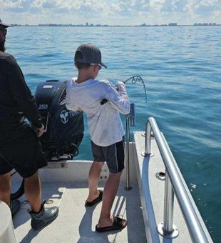 Kids learning to fish on charter trip