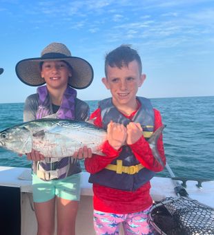 Kids smiling on Anna Maria fishing boat