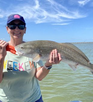 Happy angler with a Redfish catch in Port O’Connor