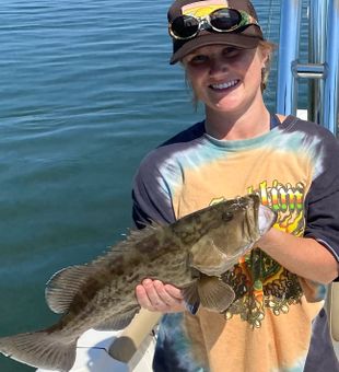 Young Angler reeling in a Grouper.