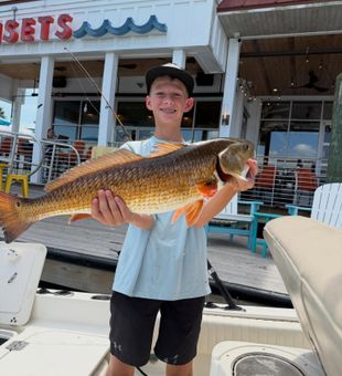 Proud Young Angler with a Charleston Redfish