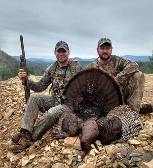 Trophy Eastern gobbler on rocky ridge