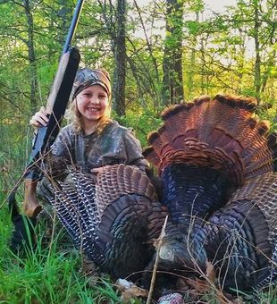 Proud young hunter with a beautiful Turkey