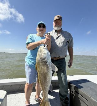 Double hookup action during an exciting Corpus Christi redfish fishing trip on the Texas Gulf Coast.