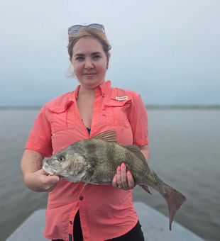 Reeling in a 17-inch Black Drum on a stormy day in Port Aransas!
