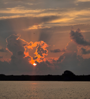 Perfect evening for light tackle drift fishing with clearing skies ahead.