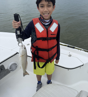 Stormy skies can't stop the redfish bite in League City!