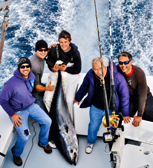 Group with Big Tuna Caught on Hatteras Blue boat in the Gulf Stream.