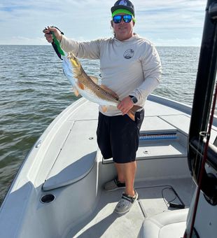 Redfish rods bending in Louisiana winds