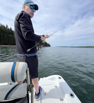 Casting for the best catch under partly cloudy skies at Damariscotta!