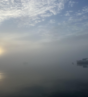 Casting lines under shifting clouds at the scenic Wiscasset Town Dock!