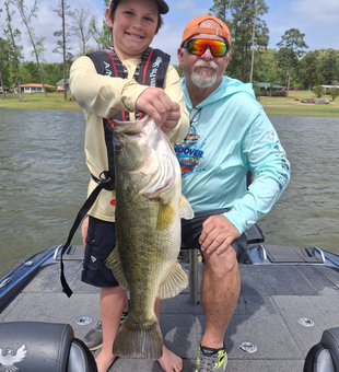 Reeling in a big one on the lake.
