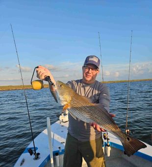 Prime redfish action in Corpus Christi with clear water, calm winds, and big bites.
