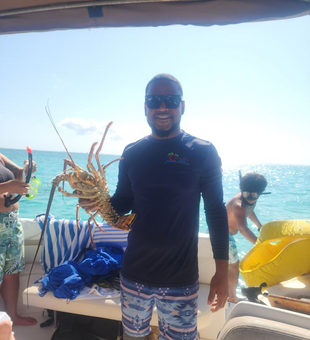Proud Cayman Islands lobster catch
