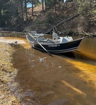 Scenic river drift boat fishing setup