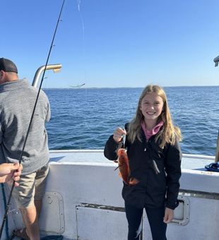 Young Angler successfully reeled in her first fish for today.