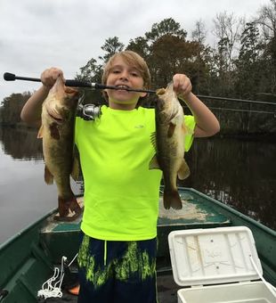 Young Angler with his 2 little Bass - St. Marks, FL.