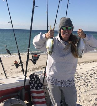 Bright Orange Beach moment with two fresh pompano.
