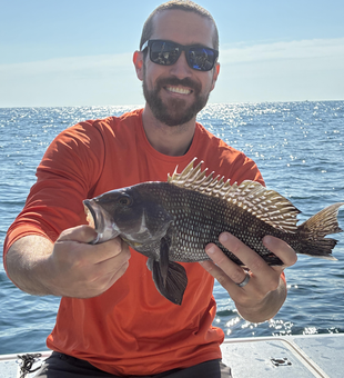 Nice sea bass using deep sea jigging in clear conditions!
