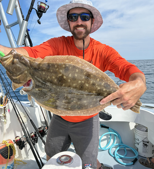 Nice Southern flounder on the boat today! Clear conditions made for some exciting fishing.