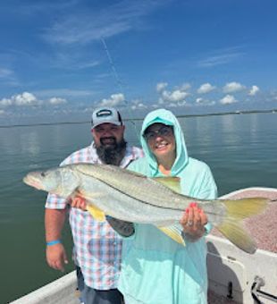 Big catch, bigger smiles on a perfect fishing day!