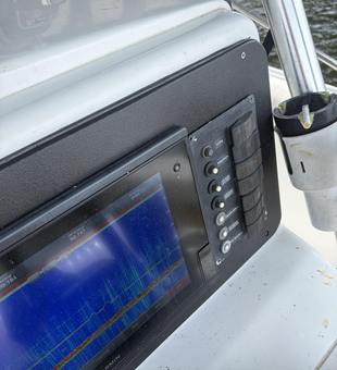 Fish finder showing sonar readings on Pensacola Bay waters.