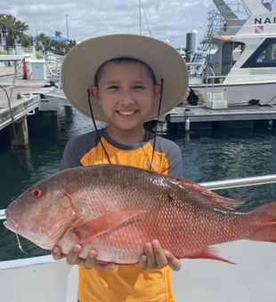 Big Red Snapper is almost the size of this kid - West Palm Beach,  FL...........