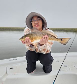 Confident redfish catch on calm waters!