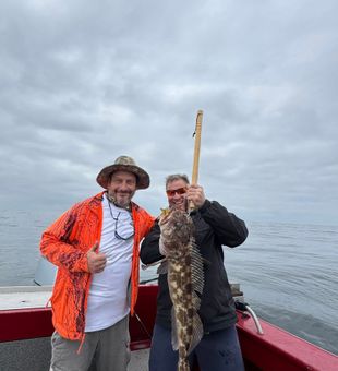 Big lingcod, happy anglers.