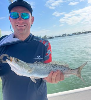 Proud angler with a solid Spotted Seatrout!