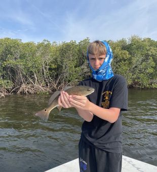 Nice catch with a lively Redfish on the flats!