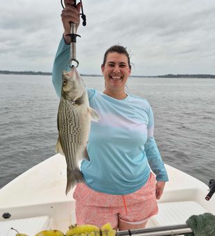 Hybrid striped bass success! Smiling and satisfied