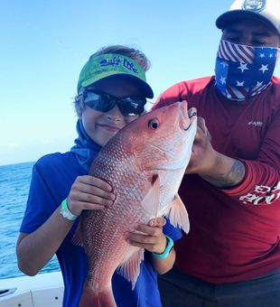 Proud red snapper catch family fishing day