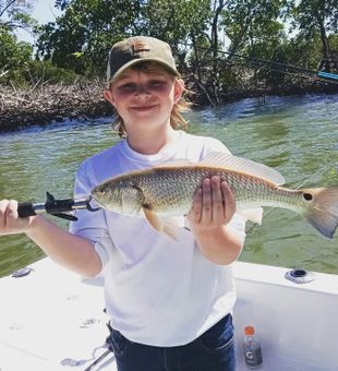 Proud redfish catch | Naples backwater fishing charter
